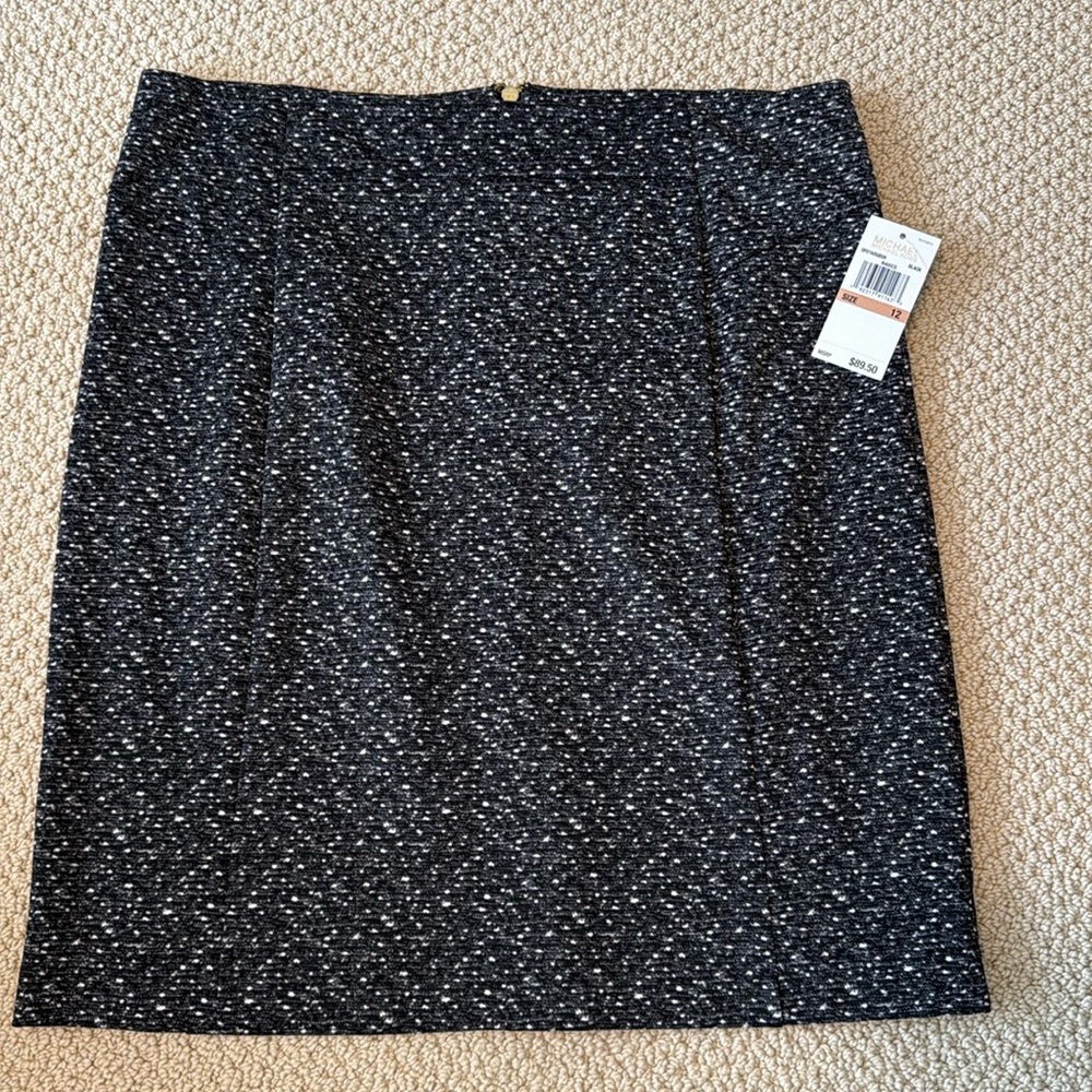 NWOT Michael Kors straight black stretchy skirt with back zip. Tag included.
